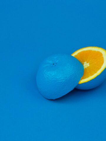 lemon sliced in half and painted blue on blue background. Represents the need for internal department change to effectively rebrand human resources