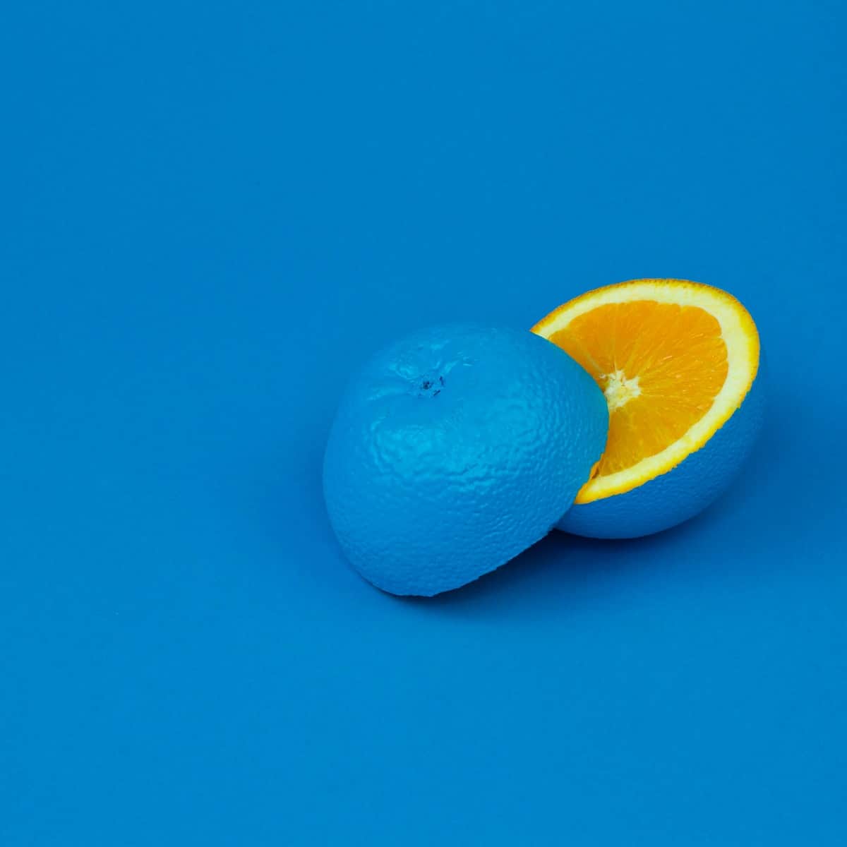 lemon sliced in half and painted blue on blue background. Represents the need for internal department change to effectively rebrand human resources