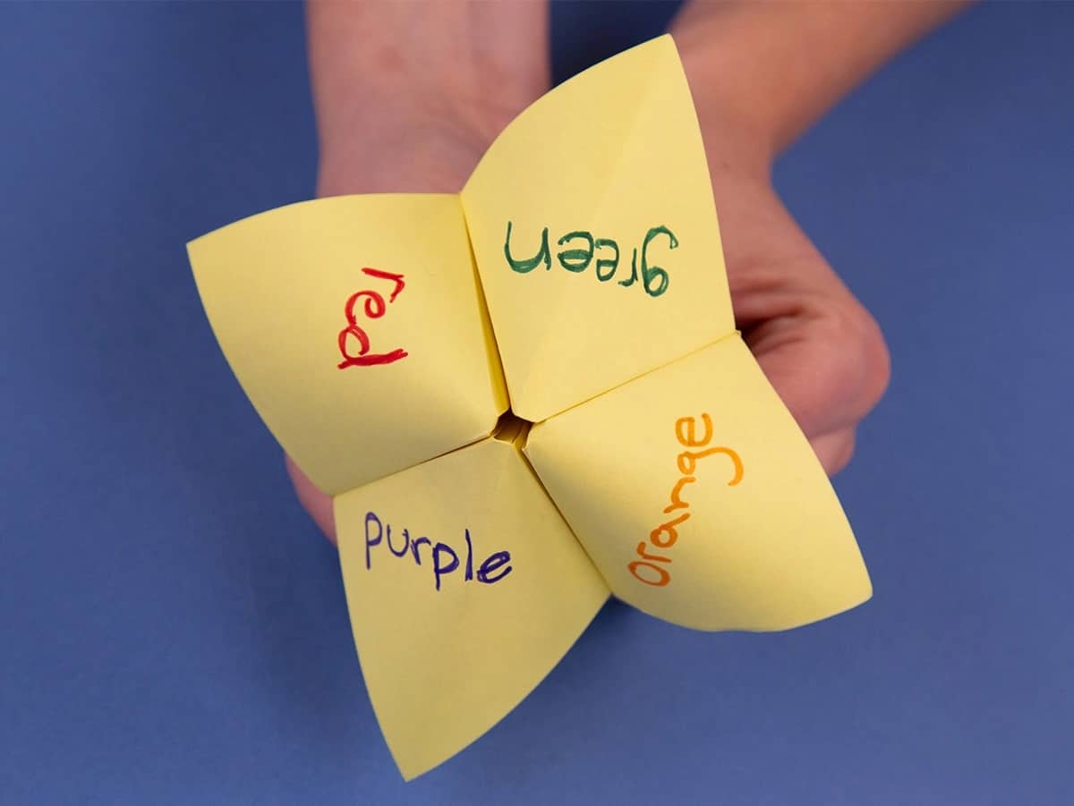 yellow paper fortune teller with words red, green, purple, and orange in each quadrant representing the names for HR thought exercise