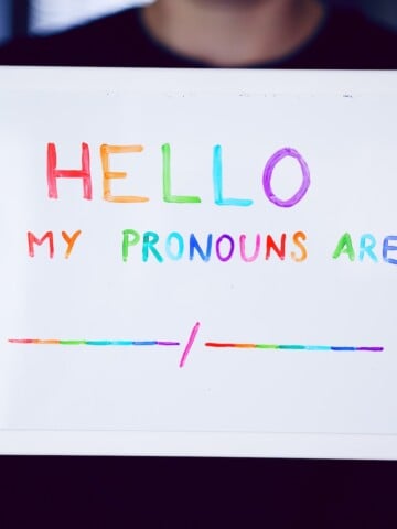 Hello my pronouns are: written in rainbow ink on whiteboard